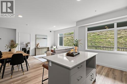 Kitchen & Dining. Photos may be of a similar home in the community. - 1111 Frost Road Unit# 202, Kelowna, BC - Indoor Photo Showing Dining Room
