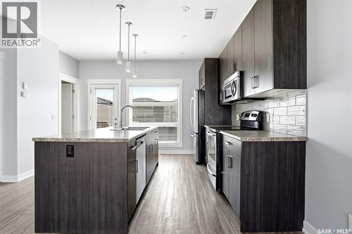 5734 Glide Crescent, Regina, SK - Indoor Photo Showing Kitchen With Upgraded Kitchen