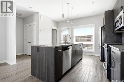 5734 Glide Crescent, Regina, SK - Indoor Photo Showing Kitchen With Stainless Steel Kitchen With Upgraded Kitchen