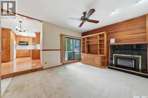 3 425 Pinehouse Drive, Saskatoon, SK - Indoor Photo Showing Living Room With Fireplace