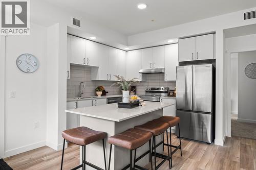 Kitchen. Photos may be of a similar home in the community. - 1057 Frost Road Unit# 418, Kelowna, BC - Indoor Photo Showing Kitchen With Stainless Steel Kitchen