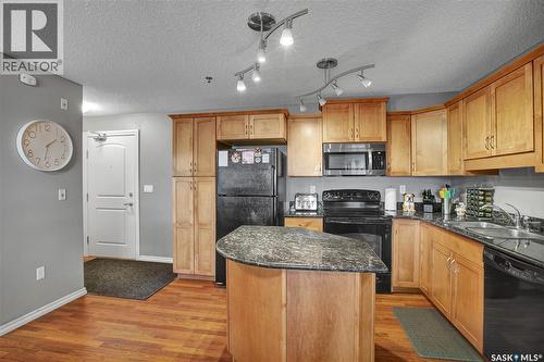 B207 103 Wellman Crescent, Saskatoon, SK - Indoor Photo Showing Kitchen With Double Sink