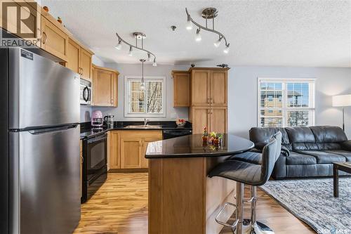 A210 103 Wellman Crescent, Saskatoon, SK - Indoor Photo Showing Kitchen With Stainless Steel Kitchen