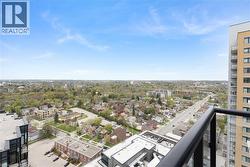 Expansive urban landscape with abundant tree canopies and distant structures - 