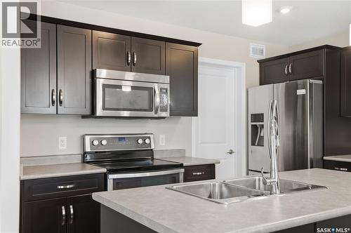 366 Kolynchuk Manor, Saskatoon, SK - Indoor Photo Showing Kitchen With Stainless Steel Kitchen With Double Sink With Upgraded Kitchen