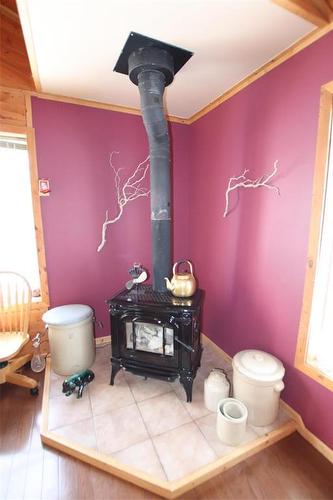 Corner Woodstove in Living Room - 156 Cottage Road, Steep Rock, MB - Indoor Photo Showing Bathroom
