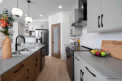 153 Gardner Trail, West St Paul, MB - Indoor Photo Showing Kitchen With Double Sink With Upgraded Kitchen