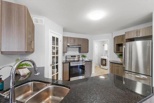278 Laxdal Road, Winnipeg, MB - Indoor Photo Showing Kitchen With Double Sink