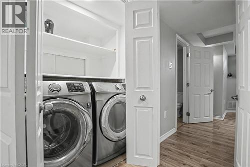 Dedicated laundry area featuring a full-size washer and dryer - 60 Postmaster Drive, Kitchener, ON - Indoor Photo Showing Laundry Room