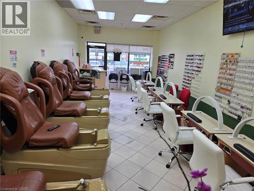 Commercial retail space featuring light-colored tile flooring, fluorescent ceiling lighting, and a glass storefront entrance - 9688 Leslie Street Unit# 16, Richmond Hill, ON 