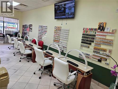 Commercial interior featuring multiple individual workstations with wood-finish desks and task lighting - 9688 Leslie Street Unit# 16, Richmond Hill, ON 