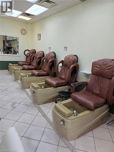 Commercial space featuring a row of five individual pedicure stations with integrated foot basins and brown upholstered seating - 9688 Leslie Street Unit# 16, Richmond Hill, ON 