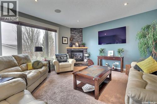 225 Willow Ridge Drive, Pilot Butte, SK - Indoor Photo Showing Living Room With Fireplace