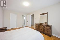 Hardwood flooring throughout, neutral wall paint, and white trim - 