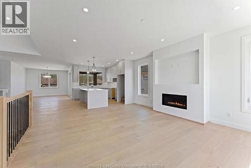 8312 Annie, Mcgregor, ON - Indoor Photo Showing Living Room With Fireplace