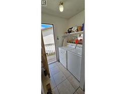 Laundry and upper floor access to the back yard. - 
