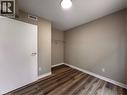 Interior room featuring wood-finish flooring, neutral wall paint, and white trim - 44 Walnut Street Unit# E01, Kitchener, ON  - Indoor Photo Showing Other Room 