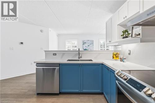 1340 Main Street E Unit# 113, Milton, ON - Indoor Photo Showing Kitchen With Double Sink