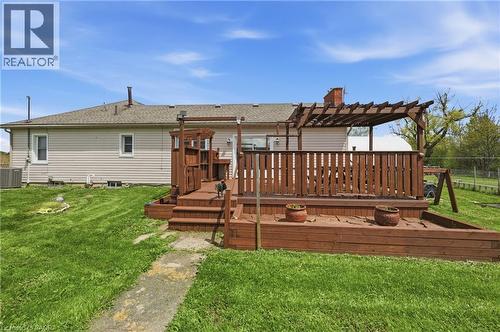 Multi-level wooden deck featuring a pergola, wood railing, and integrated planter boxes - 2934 Baker Road, Niagara Falls, ON - Outdoor With Deck Patio Veranda