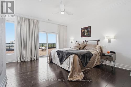 Upper: Primary Bedroom With Access to the Terrace - 1403 - 240 Villagewalk Boulevard, London North (North R), ON - Indoor Photo Showing Bedroom