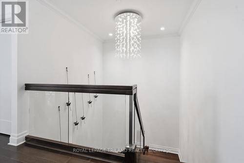 Upper: Stairs to the Lower Level - 1403 - 240 Villagewalk Boulevard, London North (North R), ON - Indoor Photo Showing Other Room