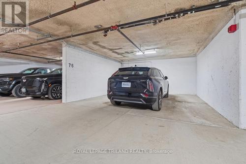 Parking: 1 of 3 Underground Parking Spots - 1403 - 240 Villagewalk Boulevard, London North (North R), ON - Indoor Photo Showing Garage