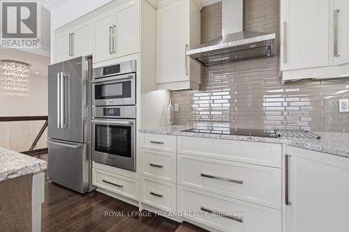 Upper: Stainless Appliances - 1403 - 240 Villagewalk Boulevard, London North (North R), ON - Indoor Photo Showing Kitchen With Upgraded Kitchen