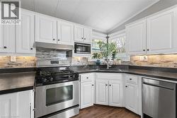 Updated kitchen with stainless appliances. - 