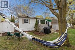 The Mature trees and side yard are a great place to relax - 