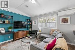 Living area is bright with big windows - 