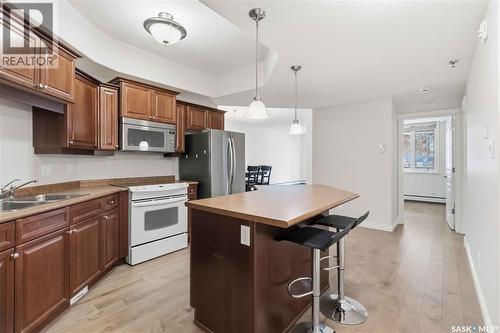 112 619 Saskatchewan Crescent W, Saskatoon, SK - Indoor Photo Showing Kitchen With Double Sink