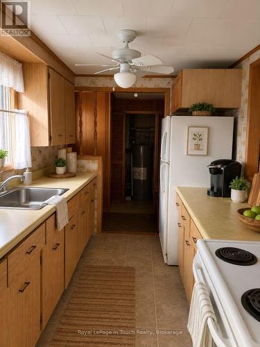 Kitchen touched with Ai edit - 43 Winterset Avenue, Tiny, ON - Indoor Photo Showing Kitchen With Double Sink