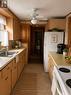 Kitchen touched with Ai edit - 43 Winterset Avenue, Tiny, ON  - Indoor Photo Showing Kitchen With Double Sink 
