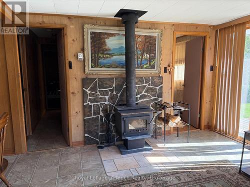43 Winterset Avenue, Tiny, ON - Indoor Photo Showing Other Room With Fireplace