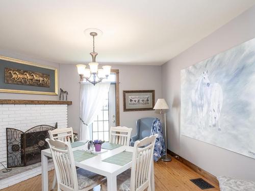 327 Calvert Rd., Murillo, ON - Indoor Photo Showing Dining Room With Fireplace
