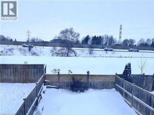 Fenced backyard with privacy lattice accent and mature trees - 193 Prosperity Drive, Kitchener, ON - Outdoor