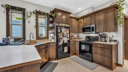 102-653 Papineau Street, Penticton, BC - Indoor Photo Showing Kitchen With Double Sink