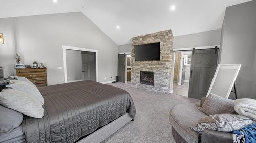 1461 Mcdonald Road, Cranbrook, BC - Indoor Photo Showing Bedroom With Fireplace
