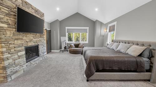 1461 Mcdonald Road, Cranbrook, BC - Indoor Photo Showing Bedroom With Fireplace