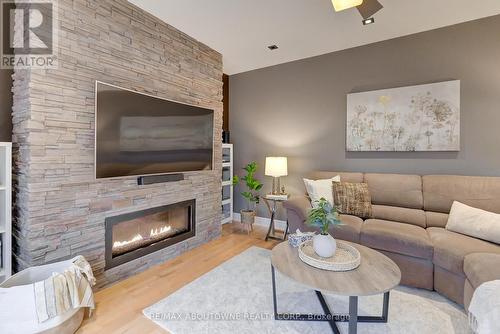 310 Leitch Landing, Milton, ON - Indoor Photo Showing Living Room With Fireplace