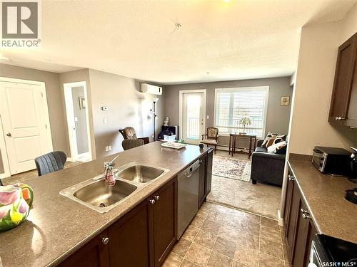 302 820 5Th Street Ne, Weyburn, SK - Indoor Photo Showing Kitchen With Double Sink