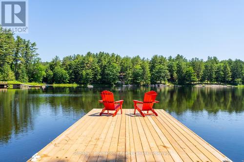 Dock at water's edge - 15 - 1213 Camp Jackson Road, Muskoka Lakes (Medora), ON - Outdoor With Body Of Water