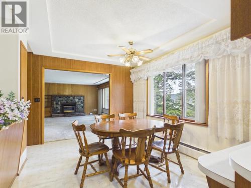 2038 White Road, Williams Lake, BC - Indoor Photo Showing Dining Room With Fireplace