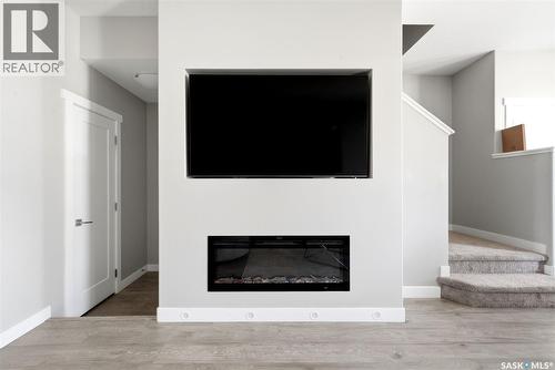 4217 E Keller Avenue, Regina, SK - Indoor Photo Showing Living Room With Fireplace