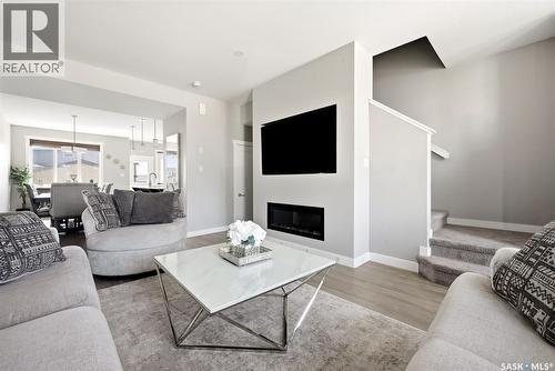 4217 E Keller Avenue, Regina, SK - Indoor Photo Showing Living Room With Fireplace