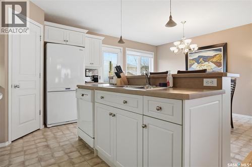 1642 Wingert Drive, Regina, SK - Indoor Photo Showing Kitchen With Double Sink