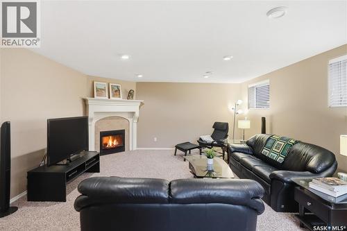1642 Wingert Drive, Regina, SK - Indoor Photo Showing Living Room With Fireplace