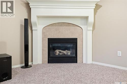 1642 Wingert Drive, Regina, SK - Indoor Photo Showing Living Room With Fireplace