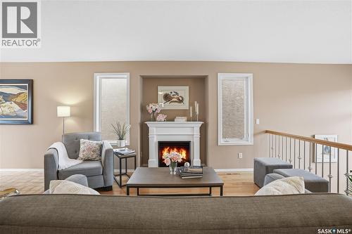 1642 Wingert Drive, Regina, SK - Indoor Photo Showing Living Room With Fireplace