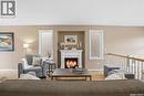 1642 Wingert Drive, Regina, SK  - Indoor Photo Showing Living Room With Fireplace 